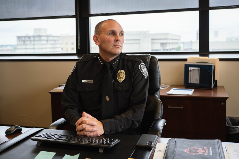 Greensboro Police Chief John Thompson sitting at a desk in his office
